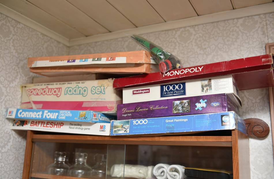 Well-worn boxes of games are ready for a rainy day.
