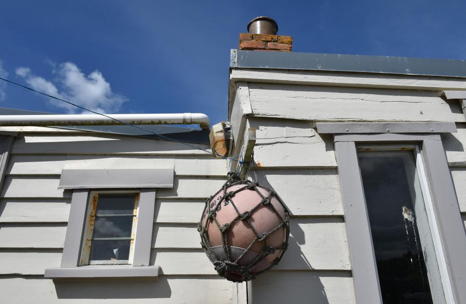 The weather-worn exterior and a beach-side souvenir.
