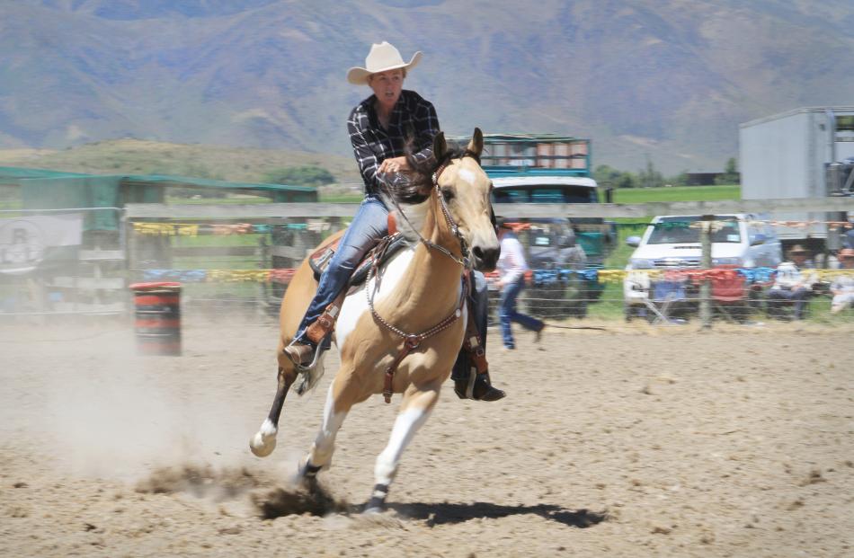 Kim Richards, of Hyde, competes in the open barrel race at the Omarama Rodeo yesterday