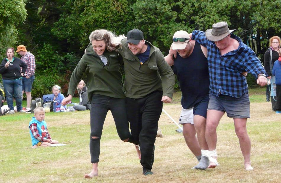 . Taking part in the three-legged race at the Papatowai Beach Carnival on New Year's Eve were (from left) Brittney Stewart and Izzy Maines of Perth, and Nick Stewart and father Stephen, of Invercargill. PHOTO: RICHARD DAVISON