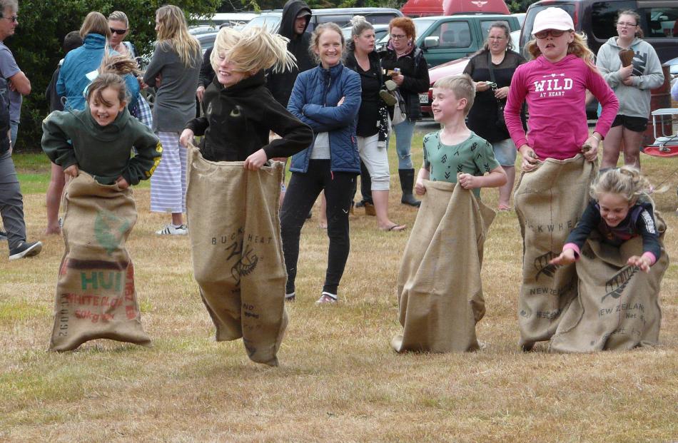 Under-12 participants in the sack race during the Papatowai Beach Carnival on New Year's Eve....