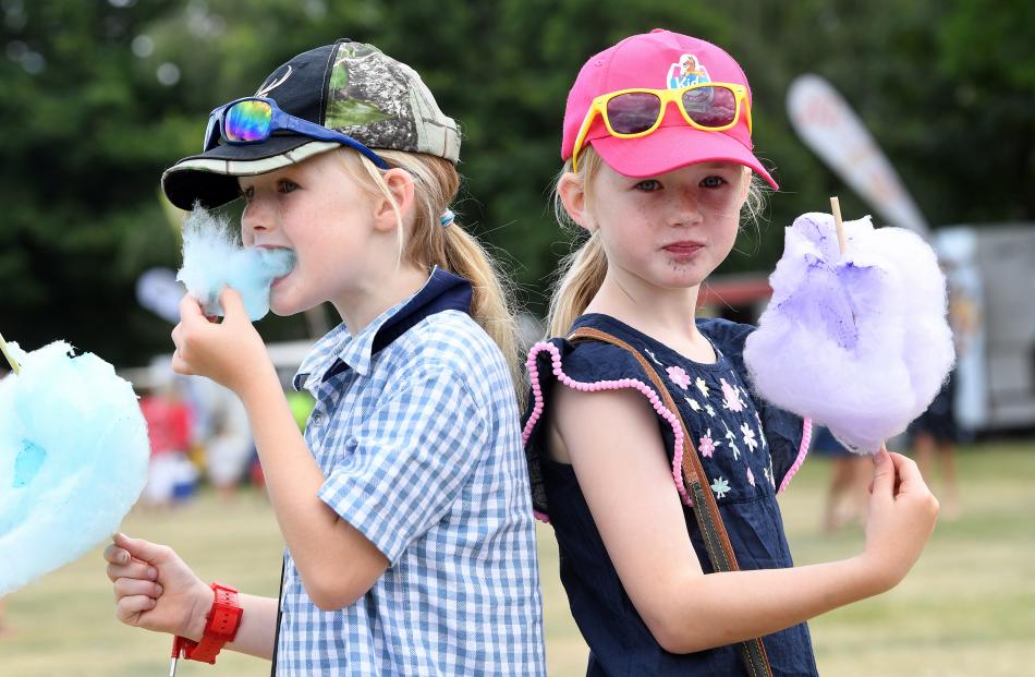Becks twins Meg and Charlotte Kirk (both 7), enjoying some candy floss.