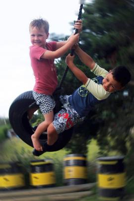 Malachi Turner  and Marcus Satake (both 5) enjoy a tyre swing at Malachi’s  home in Brighton on...