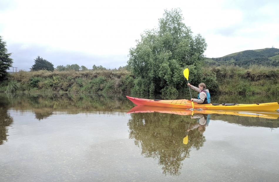 Claudia Sole (21) paddles on the Waikouaiti River near Karitane on New Year’s Eve. Photo: Chris Sole