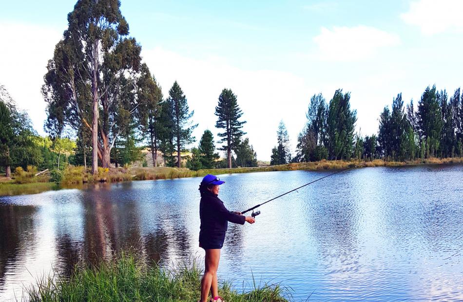 Gerry Hunter tries her hand at fishing for the first time at Coalpit Dam in Naseby. Photo: Rob Hunter