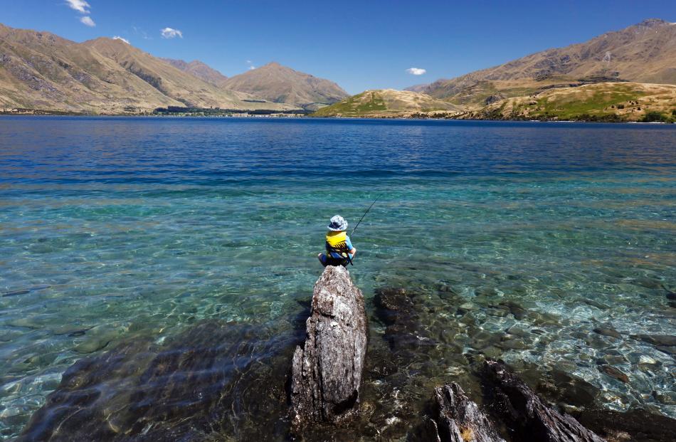 Flynn Trickey (7), of Dunedin, fishes on his own for the first time, at Lake Wanaka last week. Photo: Jared Mason
