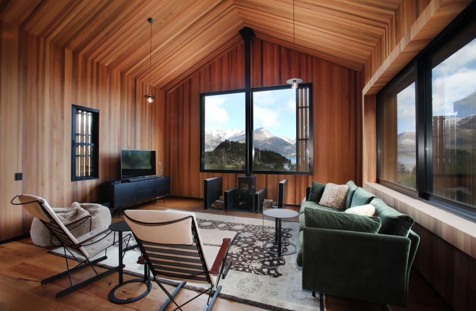 The comfortable living area boasts lake and mountain views. 