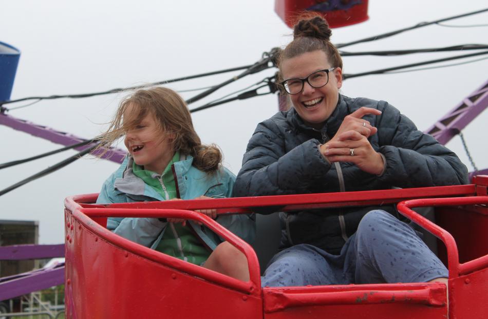 Megan Graham and her daughter, Jodie (8), enjoy the Octopus ride at the 105th Winton A&P Show....