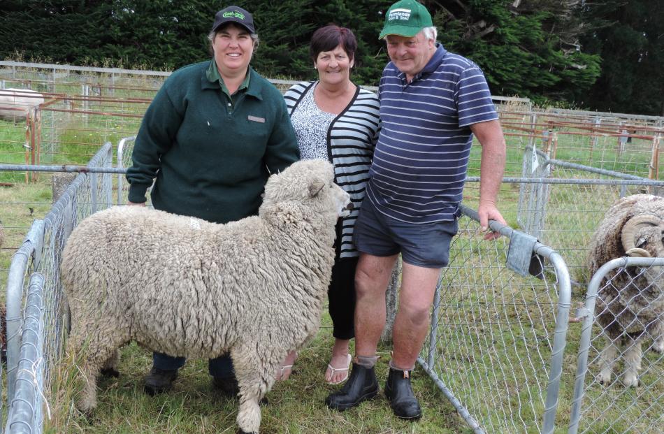 Anita Erskine (left) went all the way from Tuatapere to buy this ram bred by Rolleston farmers Karen and Leo Ponsonby for $610. Photos: Sally Brooker