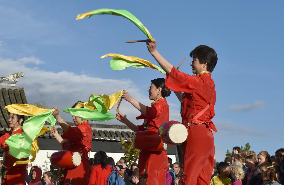 Costumed performers entertain the crowd, marking the start of the Year of the Pig.