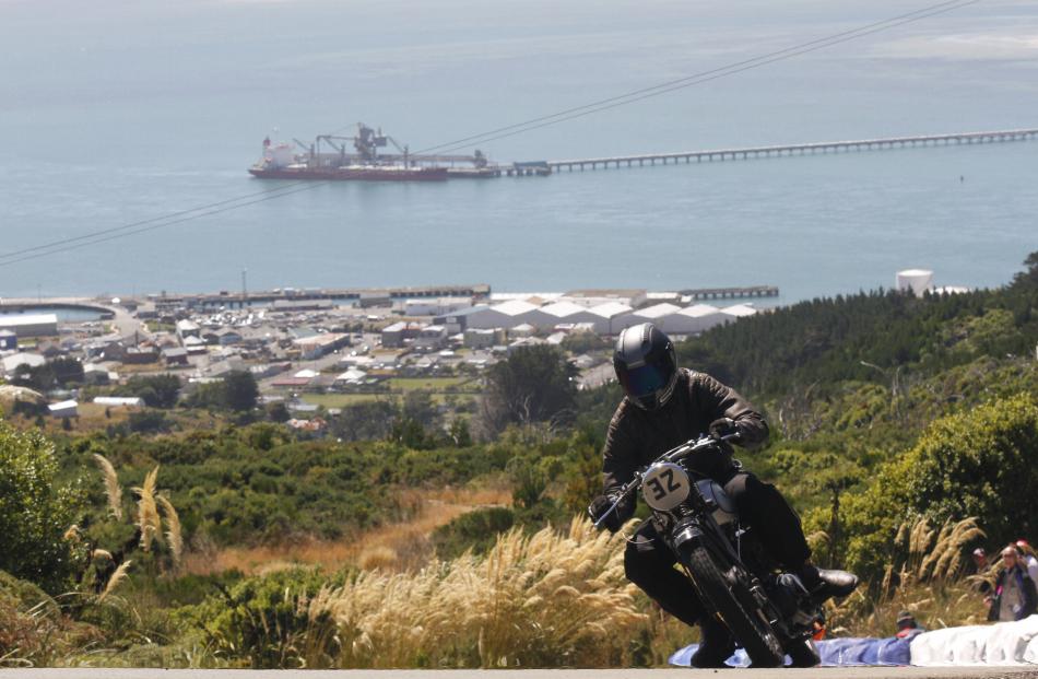 Bluff's port behind him, Byron Clothier from Katikati powers his 1946 Norton ES2 up the hill. 