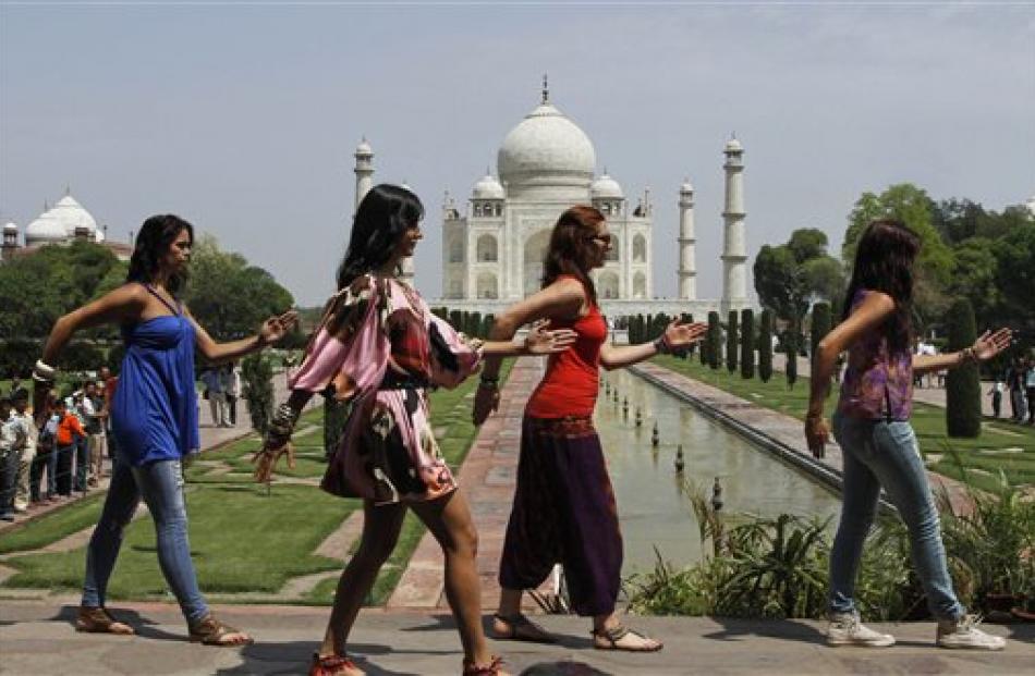 Actress Katrina Kaif, second left, films a Bollywood movie at the Taj Mahal in Agra, India. (AP...