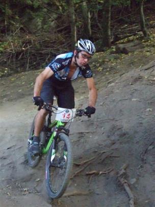 Individual competitor Geoff Small races through an S-bend turn near the end of the Ben Lomond...