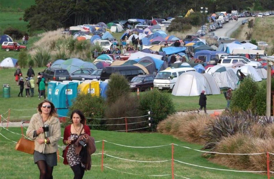 Some of the large crowd the event attracted head towards the music.