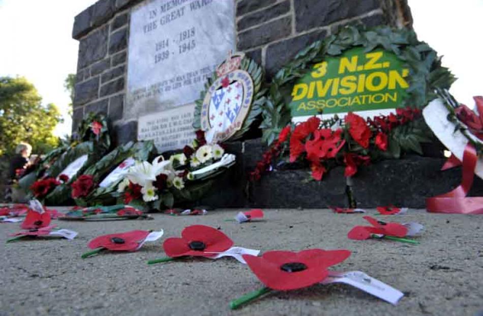 Poppies left by members of the public after the ANZAC Day service at the Mosgiel war memorial...
