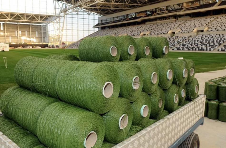 Reels of the polyethylene material wait to be inserted.