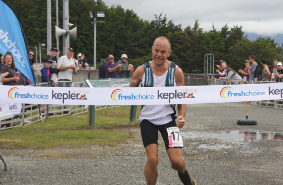 Fiordland Athletics Club Captain and Te Anau police officer Dwight Grieve shows his emotion as he...