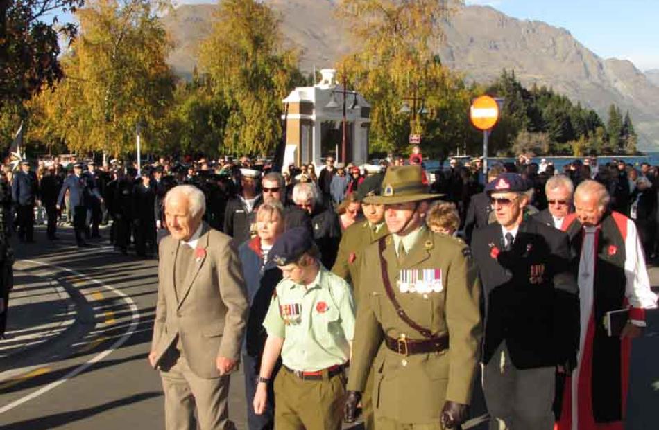 Service personnel past and present march side by side in Queenstown. Photo by James Beech.