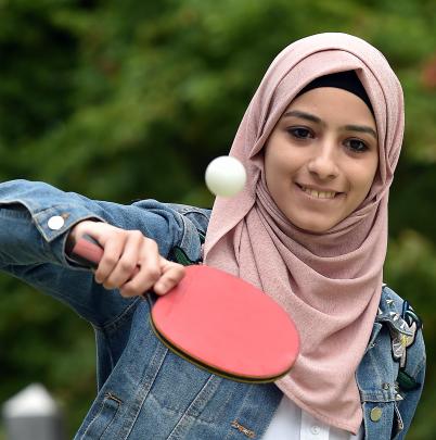 Student Tabarak Barham blocks back a table tennis ball. PHOTO: PETER MCINTOSH
