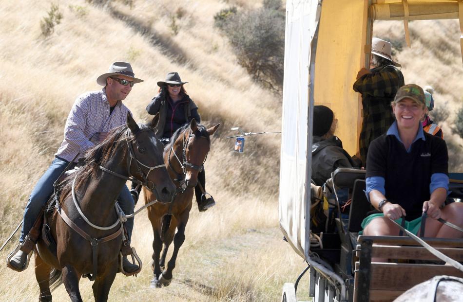 Middlemarch farmer Andrew Templeton has a novel way of getting a beer from a wagon driven by...
