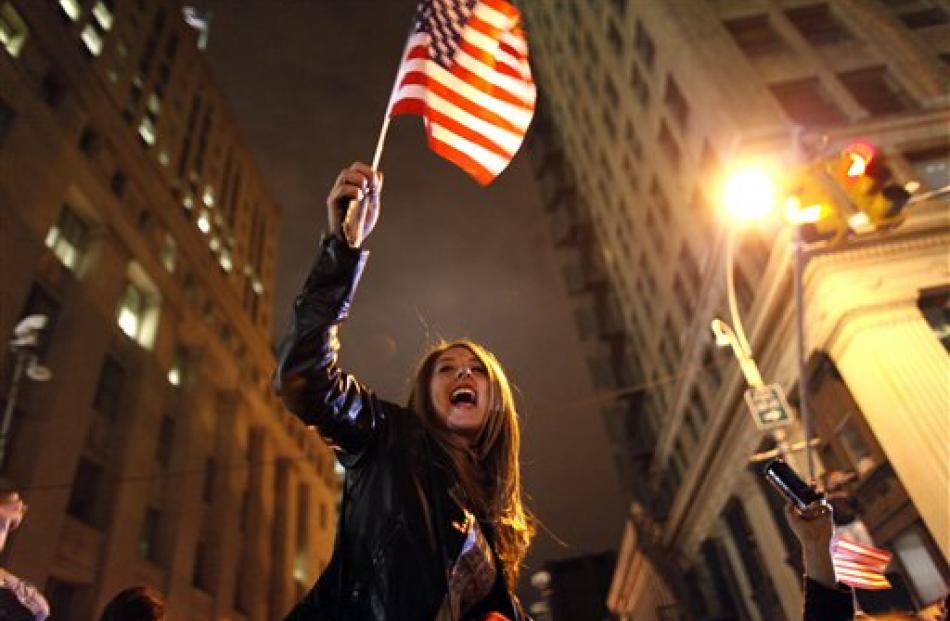 A crowd reacts to the news of bin Laden's death at the corner of Church and Vesey Sts in New York...