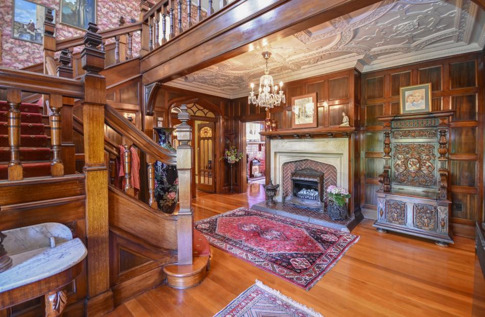 The fireplace in the entrance hall once ran on reticulated gas, but has since been converted to...