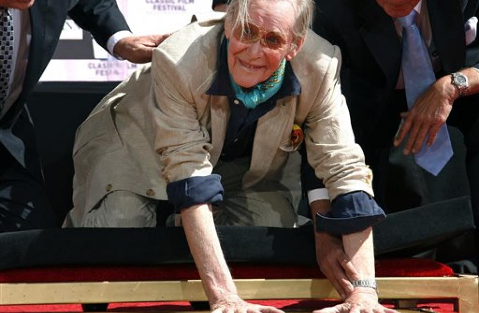 Actor Peter O’Toole places his handprints in cement as he is honoured during the TCM Classic Film...