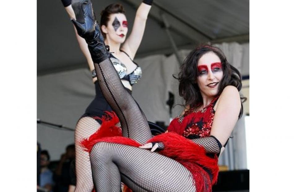 Members of the New Orleans Bingo! Show perform at the New Orleans Jazz and Heritage Festival in...