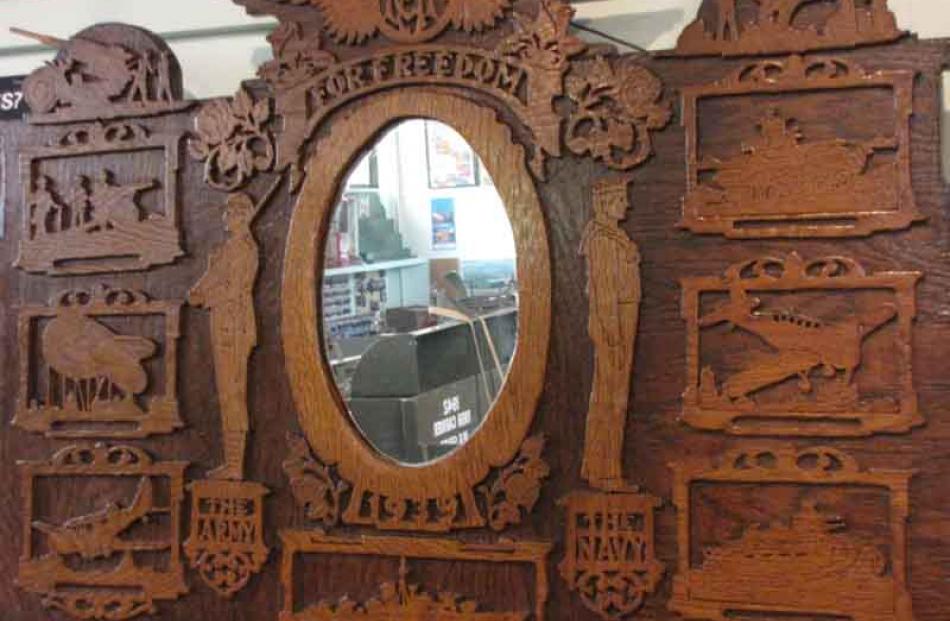 An ornate mirror commemorating WW2.