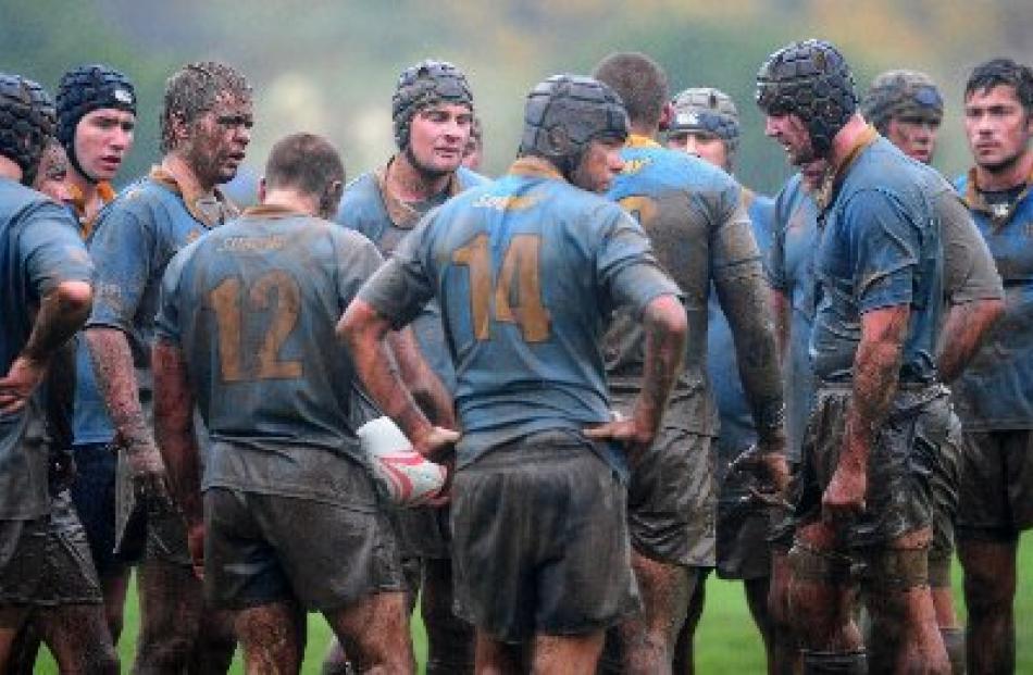 University A players react after losing the match.