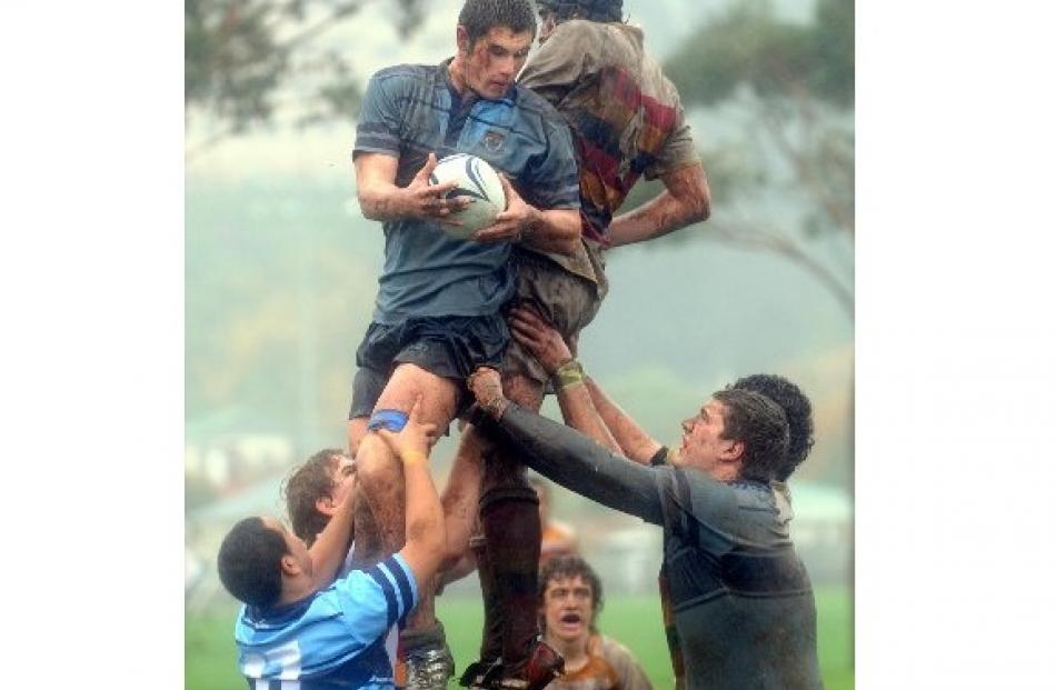 Connor Kent (King's) takes a lineout ball while challenged by John McGlashan's Tom Simmers.
