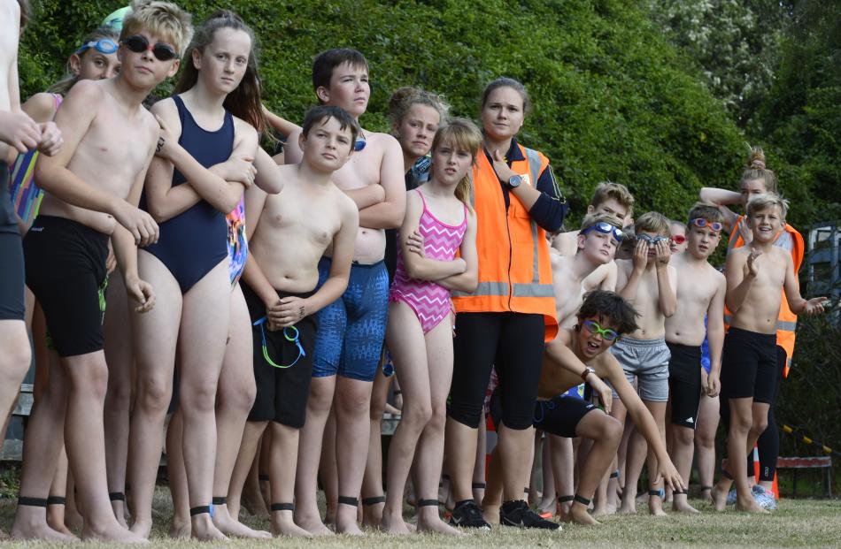 Swimmers look out for their team-mates as they wait their turn.