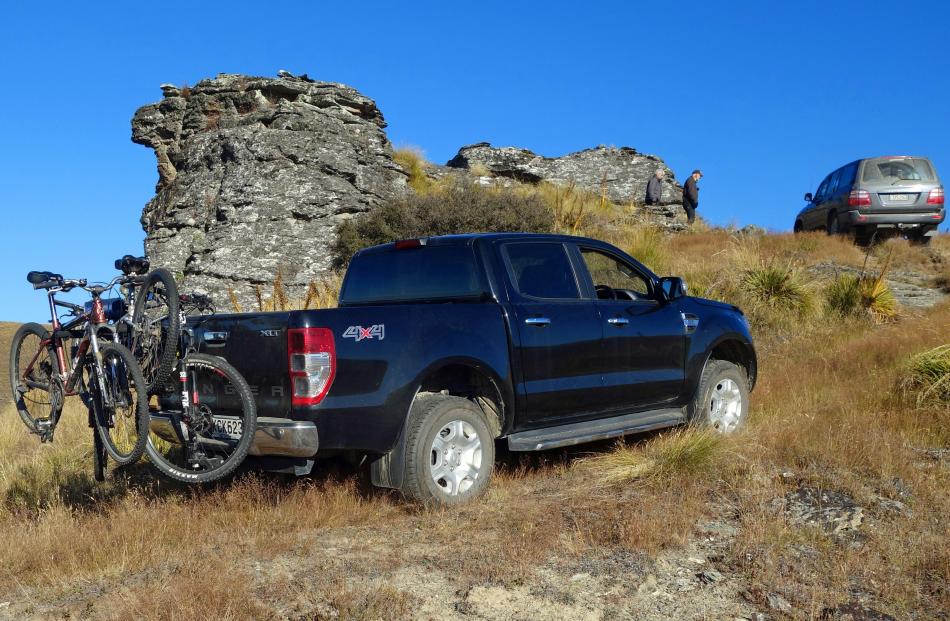 The 4WD support vehicles find the going challenging as they head up Grandview Track, heading for...