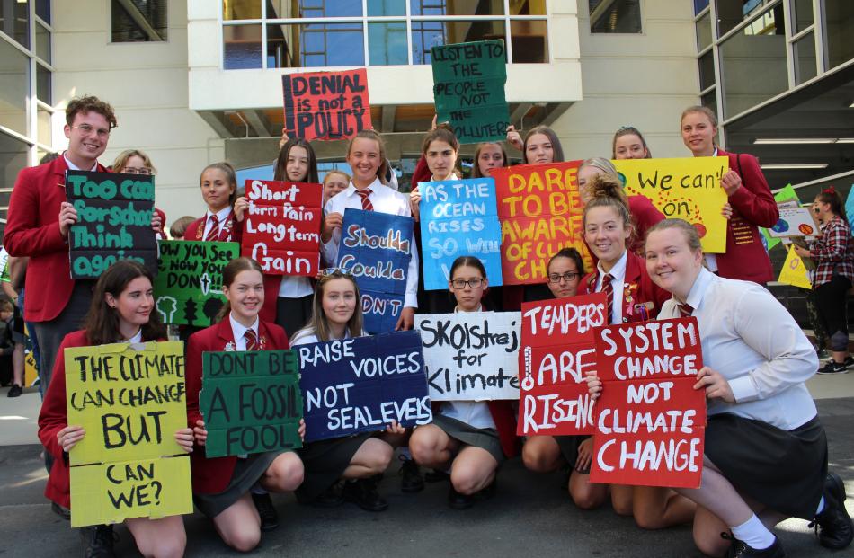 Invercargill school pupils hold their placards before the Strike 4 Climate today. Photo: Petrina Wright