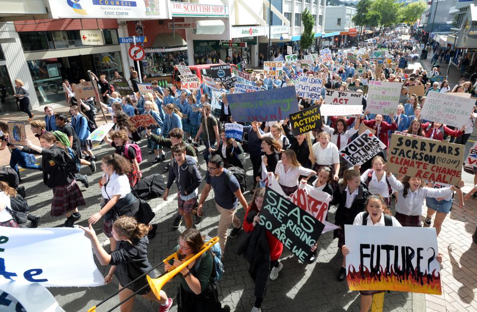 Hundreds of Dunedin pupils march down George St yesterday as part of the global School Strike 4...