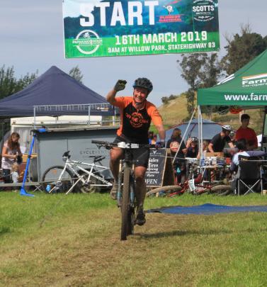 Champion endurance mountain biker Ronel Cook celebrates another lap at the challenge.
