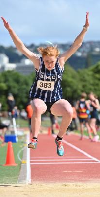 St Hilda's Collegiate's Ella Grayson in mid-air during the under-15 girls triple jump at the...