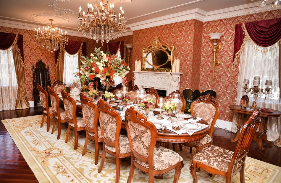 Gold wallpaper lines the banquet room. 