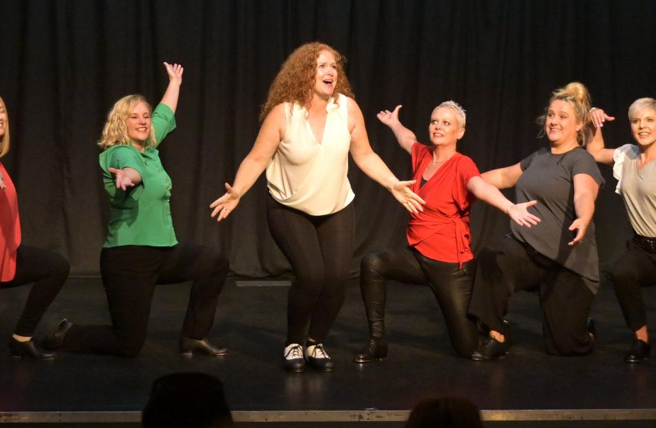 Glenna Armstrong leads the Song and Tap Troupe. 