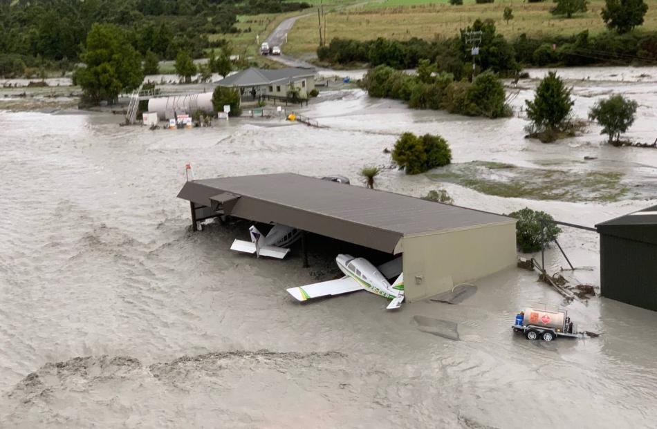 The flood waters have swamped planes in the area. Photo: Wayne Costello, DOC
