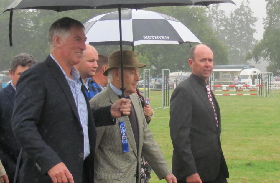 Methven A&P Show president Simon Wilson (far right) walks next to patron Michael Poff and...