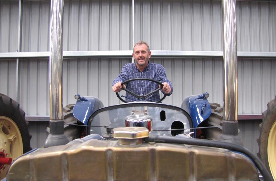 Wheels at Wanaka originator Allan Dippie at the wheel of his ‘‘bogan’’ Super Major tractor....