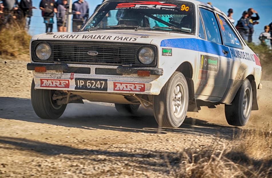 Australians Grant Walker and Tracey Dewhurst get airborne in their Ford Escort RS1800 on Saturday...