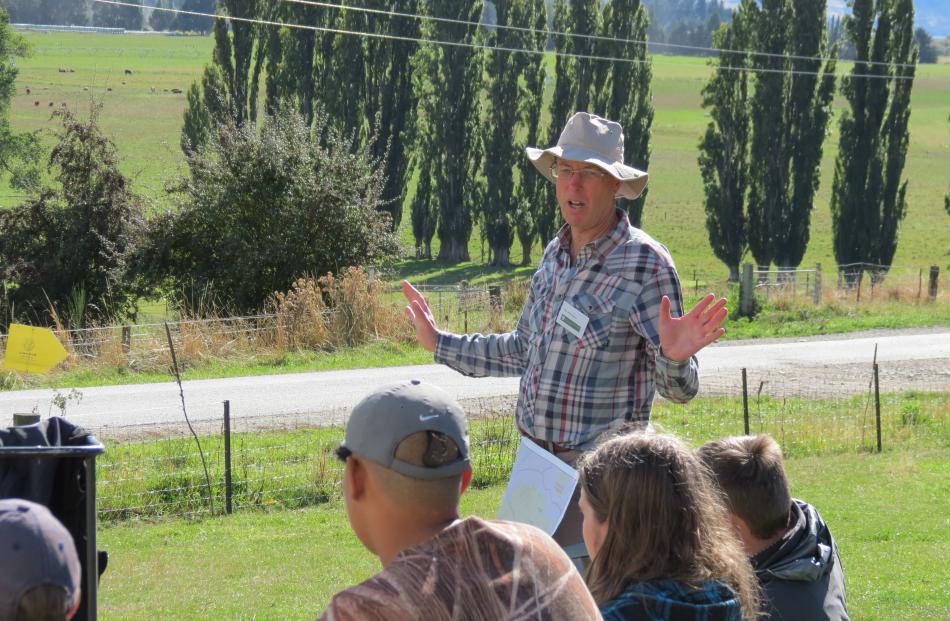 Department of Conservation officer Tim Whittaker, of Alexandra, talks to pupils about early human...