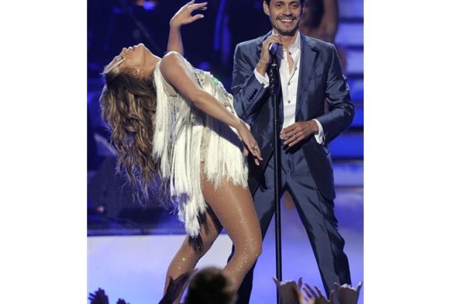 Jennifer Lopez dances as Marc Anthony performs at the 'American Idol' finale. (AP Photo/Chris...