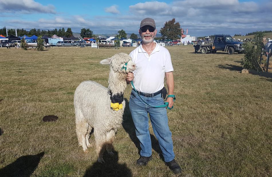 Neil Godfrey with his alpaca which won the FMG Supreme Livestock Exhibit over the show and Supreme Alpaca Champion prize.