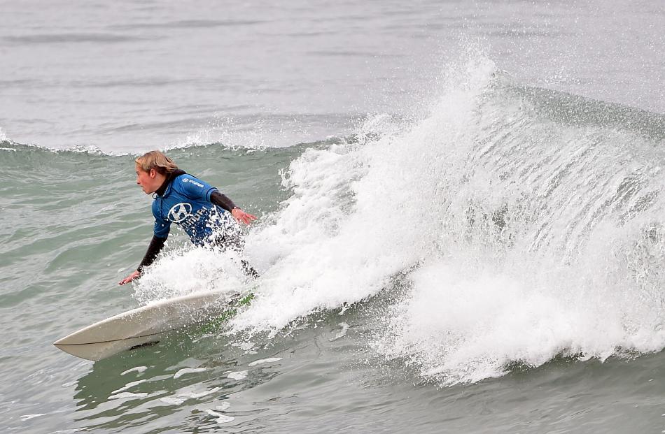 King's High School year 10 pupil Bailey Pearce (14) shows his style in the surfing interschool...