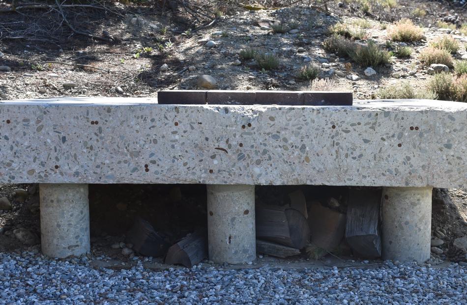 A piece of the back wall that was removed when the carport and laundry were added. This concrete...