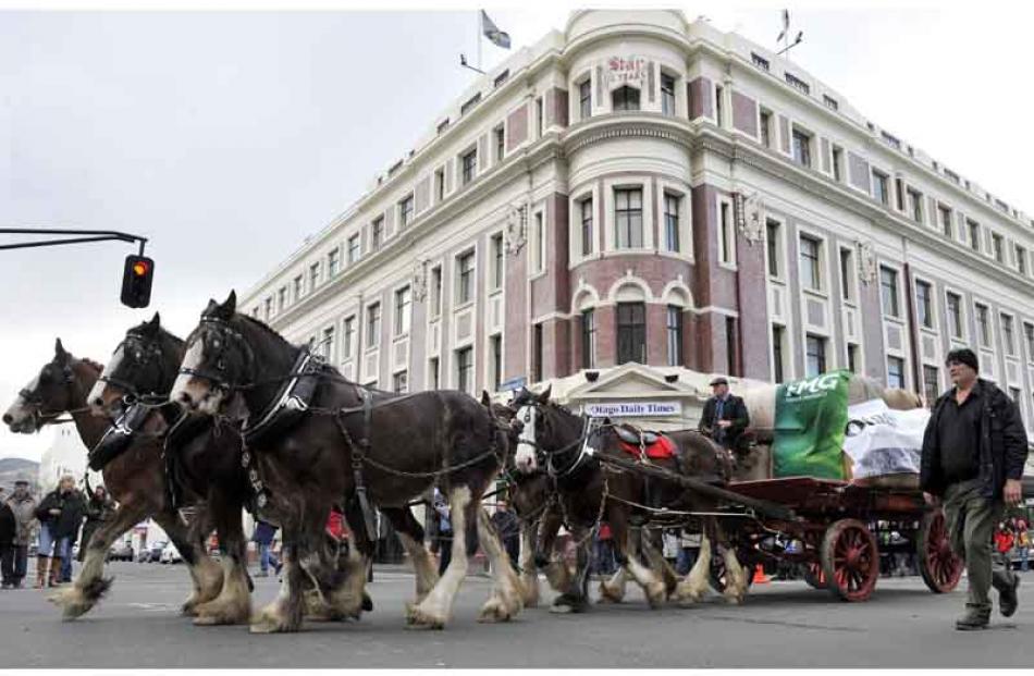 The Otago Daily Times wagon passes the Otago Daily Times building in Stuart St.