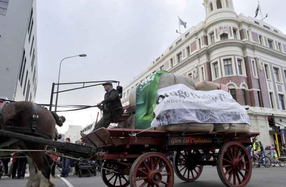 The street parade passes the Otago Daily Times wagon in Stuart St.